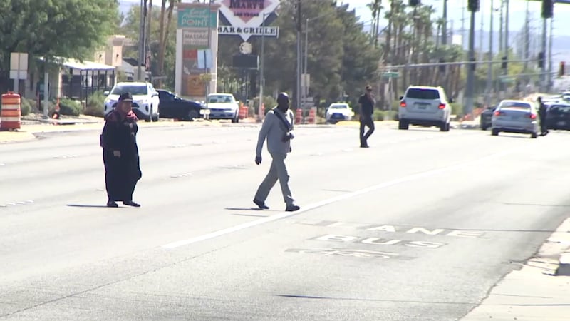 Pedestrians dangerously crossing on Flamingo just east of Maryland Parkway