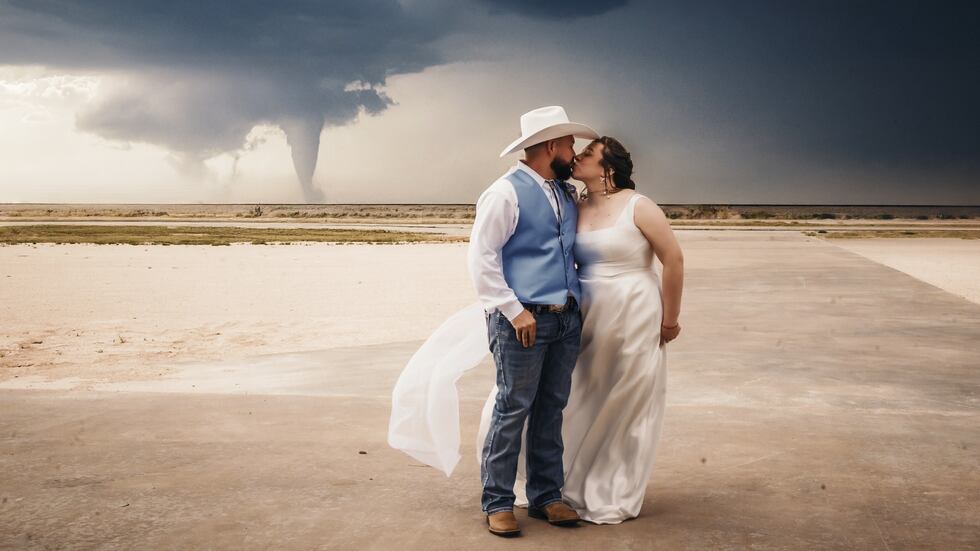 A Portales couple’s wedding photo is going viral, showing a massive tornado in the background....