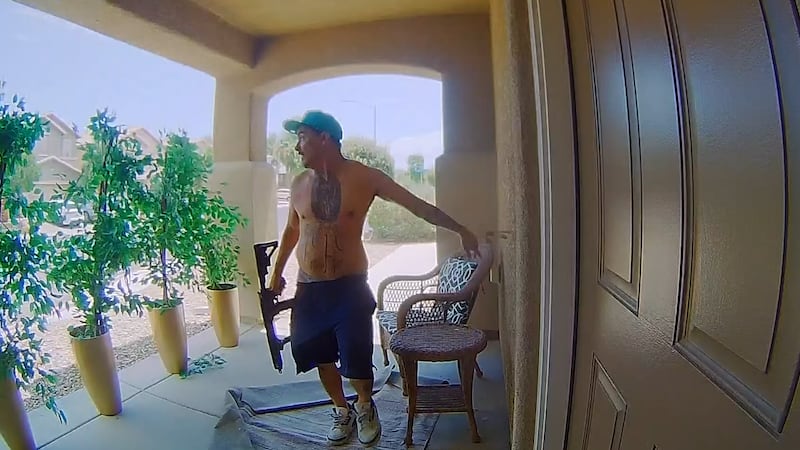 A man with an AR-15 banged on doors and fired in a North Las Vegas neighborhood Sunday before...