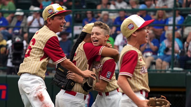 Henderson, Nev.'s Gunnar Gaudin, center right, celebrates with Noah Letalu, center left,...
