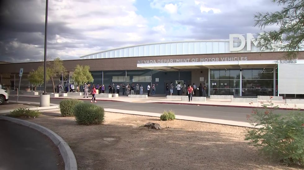 People wait in line outside the Nevada Department of Motor Vehicles office in Las Vegas on...