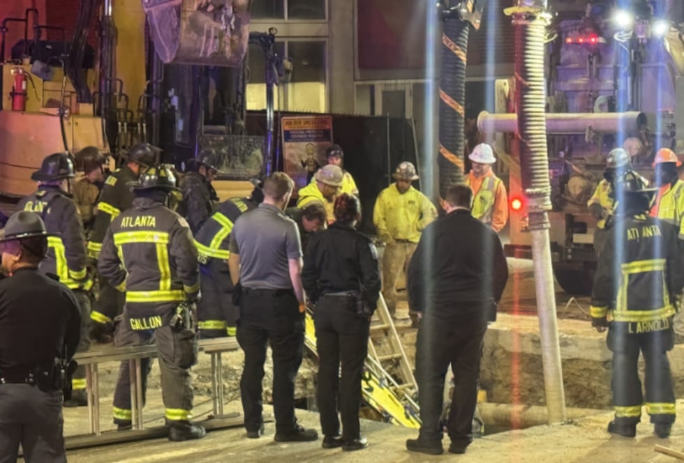 Atlanta construction worker falls in hole.