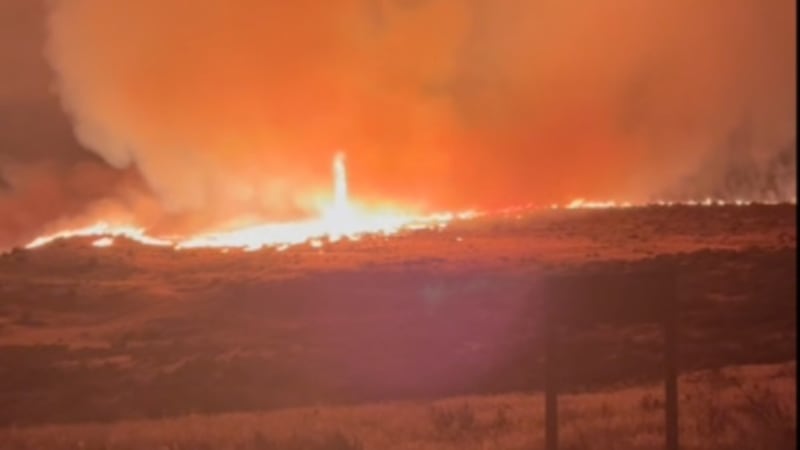 The Hawk Fire burns Saturday near a residential area north of the Somerset neighborhood in...