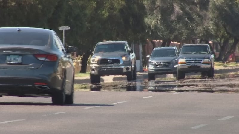 Photo of cars driving along a hot street in Phoenix, Arizona.