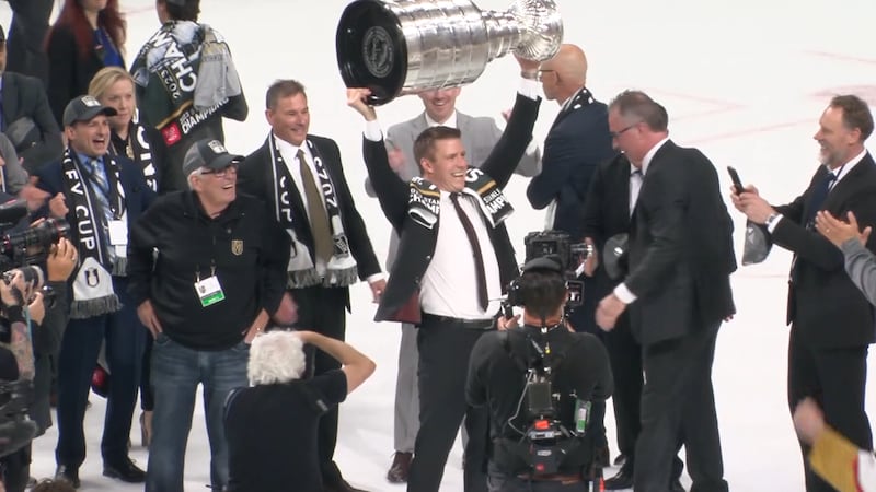 Ryan Craig, who has been named as the next Vegas Golden Knights head coach, raises the Stanley...