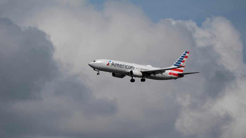 An American Airlines plane comes in to land at Miami International Airport, Monday, Nov. 10,...