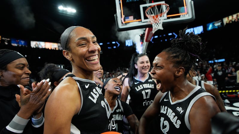 Las Vegas Aces center A'ja Wilson (22) and Las Vegas Aces guard Chelsea Gray (12) celebrate...