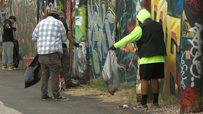 Volunteers clean up trash in the Arts District