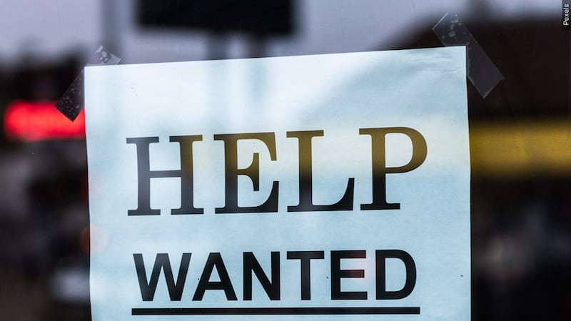Help wanted sign posted in place of work
