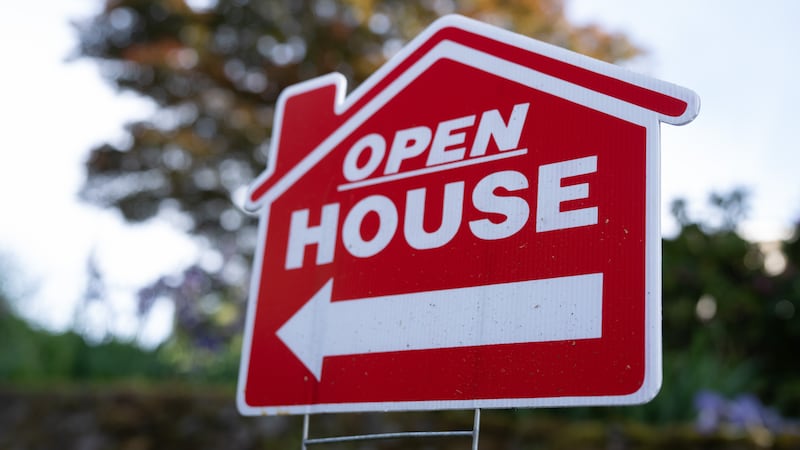 FILE - A sign is displayed outside a home for sale on Tuesday, May 12, 2026, in Portland, Ore.