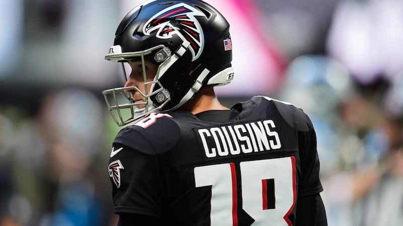 Atlanta Falcons quarterback Kirk Cousins (18) walks between plays in the second half of an NFL...