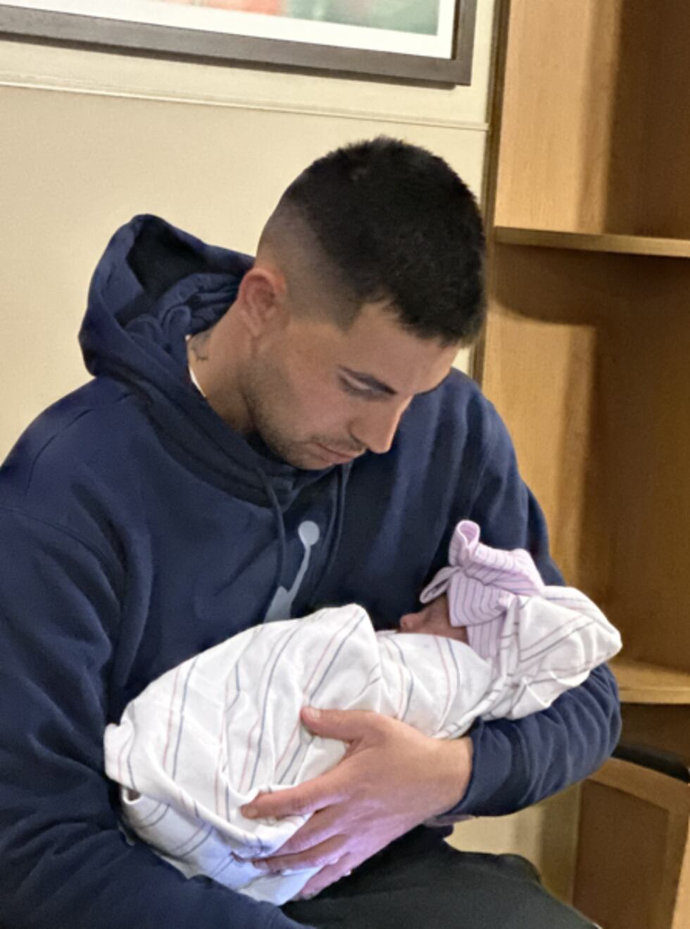 A motorcyclist and new father remains hospitalized after a hit-and-run crash Monday evening in...