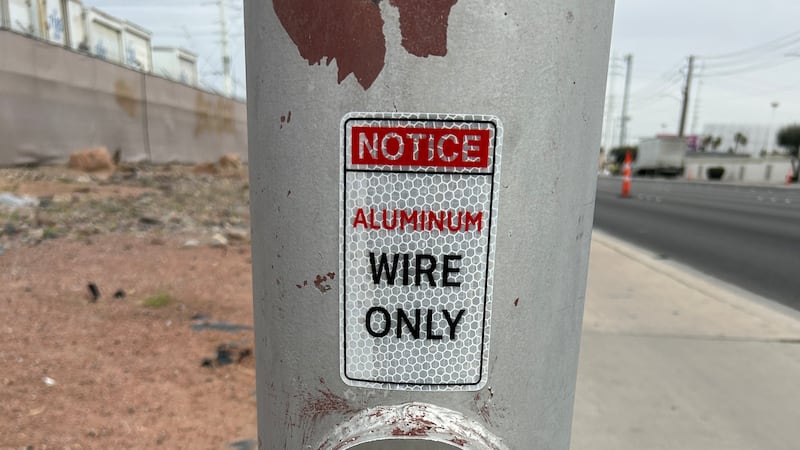 Clark County is placing stickers on street light poles that read “Notice: Aluminum Wire Only”...